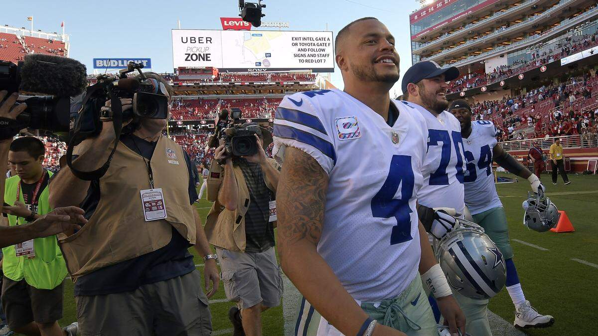 Dallas Cowboys quarterback Dak Prescott (4) was all smiles as he heads to the locker room after the Cowboys beat the 49ers 40 to 10 in NFL football at Levi’s Stadium in Santa Clara, CA, Sunday, Oct. 22, 2017.