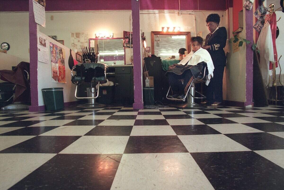 Dec. 20, 1999: Idar Wilkinson, right, has done her granddaughter Keshia Fields’ hair for all of her 13 years at Ida's Fashionaire Beauty Salon in Stop Six in Fort Worth. After 46 years, Wilkinson is closing the doors of her salon on Christmas Eve.