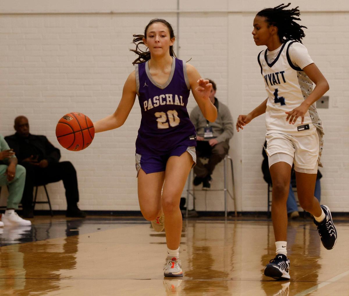 Paschal guard Bella Zoll (20) drives down court defended by O.D. Wyatt forward Trinity Mitchell (4) during a UIL girls basketball game at O.D. Wyatt High School in Fort Worth, Texas, Friday, Jan. 24, 2025.