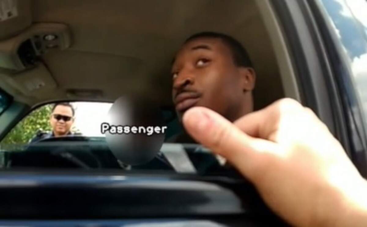 An Arlington police officer has been indicted in the shooting of O’Shae Terry. Officer Bau Tran is seen out of Terry's passenger window in this image from video released by police.