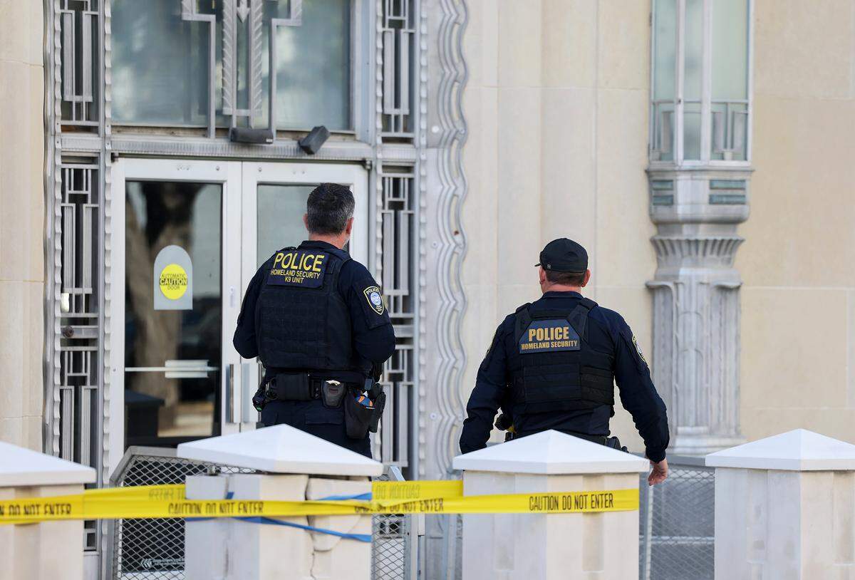 Homeland Security officers outside the federal courthouse in downtown Fort Worth on Thursday, March 12, as the jury deliberated in the trial against nine defendants indicted in connection to the nonfatal shooting of a police officer outside a North Texas ICE detention center last year.