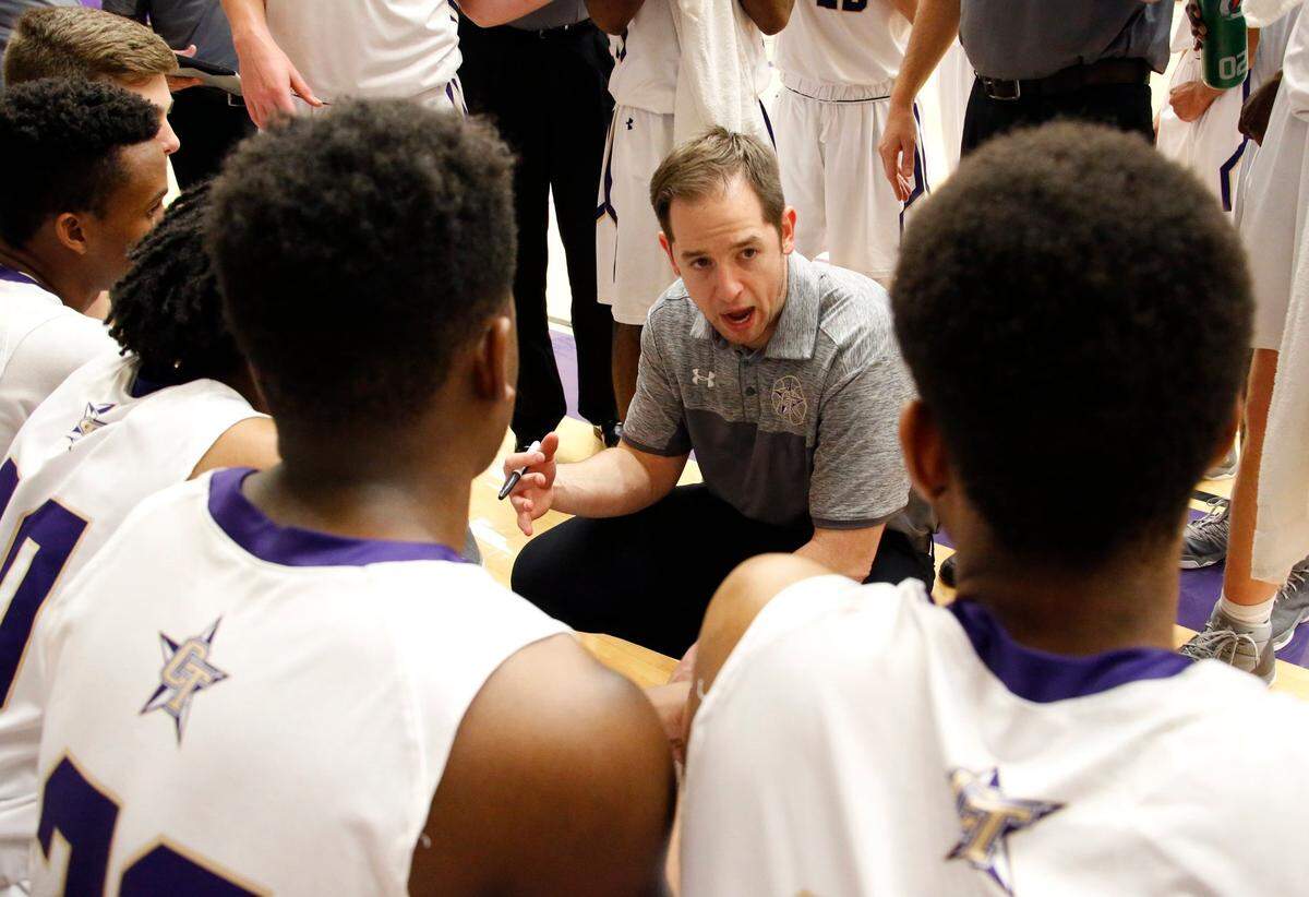 CT’s head coach David Markley with his bench during a third quarter time out as Azle plays Chisholm Trail in Fort Worth, Friday, January 20, 2017, in Euless.