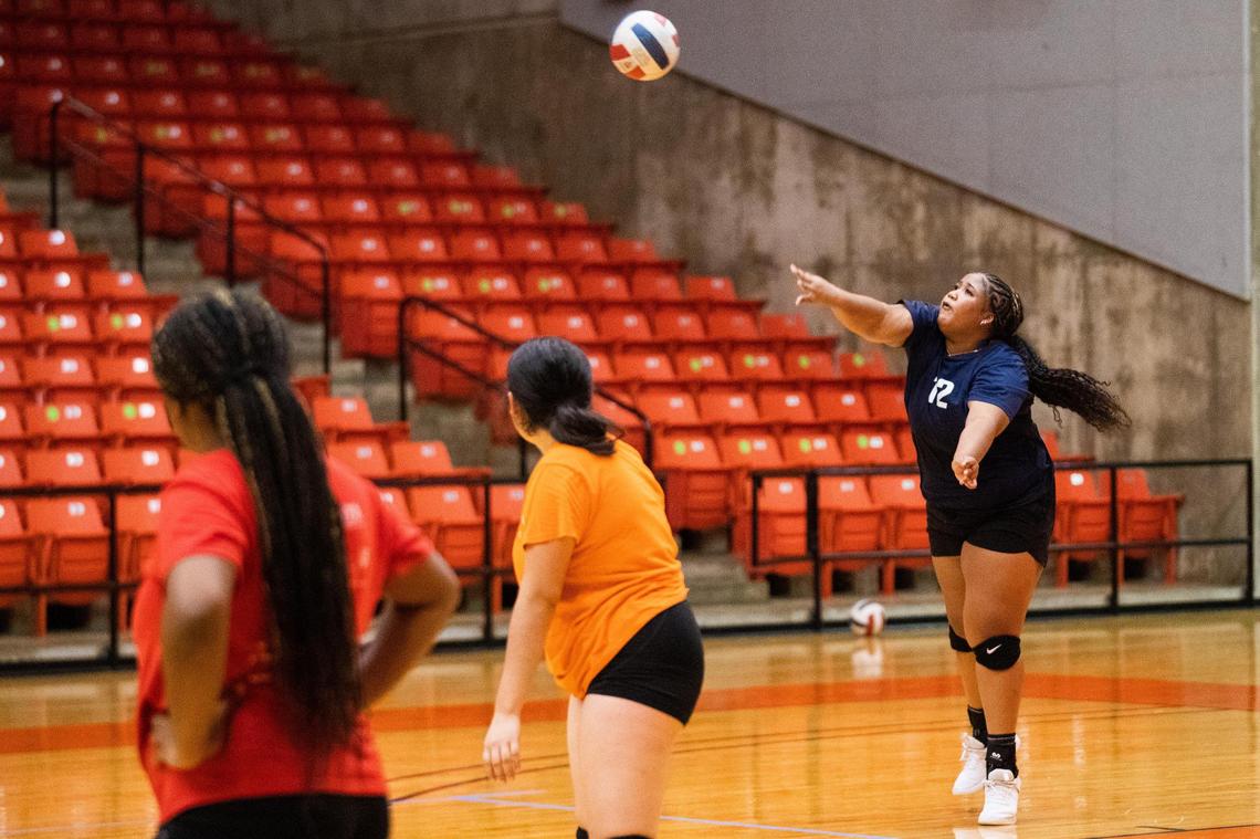 Kaci Martin, 15, serves the ball during a Young Women’s Leadership Academy volleyball practices before the team heads to playoffs for the first time Oct. 20, 2021, at Wilkerson-Greines Activity Center in Fort Worth. The team doesn’t have a home court and has to commute more than 10 minutes to the district court.