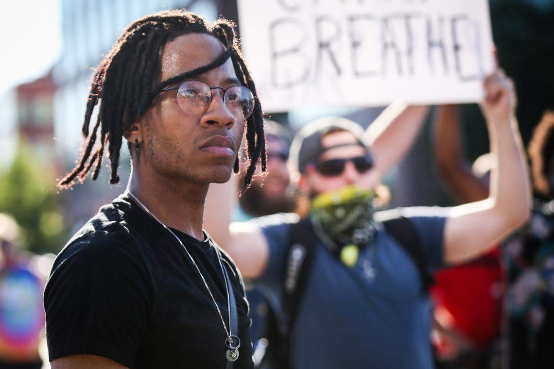 Lucid Shinobi along with hundreds of protesters march in a circle in the intersection of West 7th Street and University Drive Wednesday, June 3, 2020, in Fort Worth.