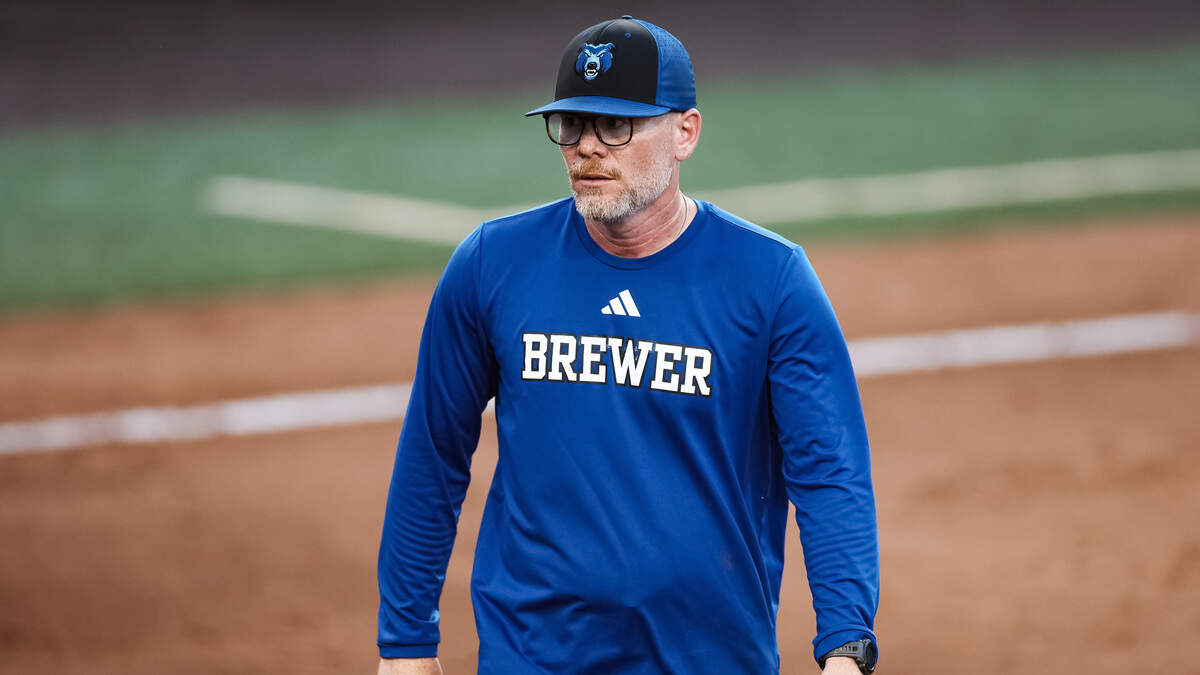 White Settlement Brewer head coach Josh Richards walks toward his dugout after taking a mound visit in the UIL Class 5A Division II state softball championship game against Montgomery Lake Creek at Red & Charline McCombs field in Austin, Texas, on Friday, May 29, 2026.
