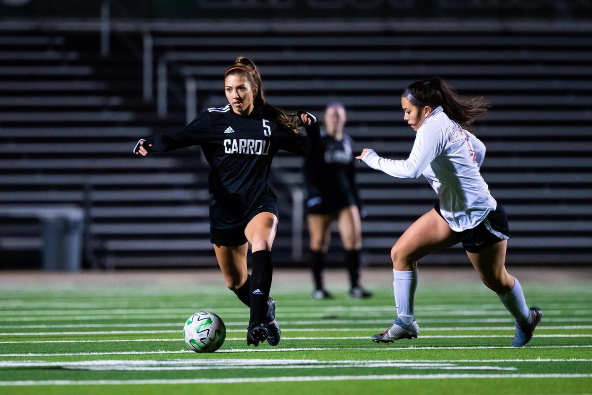 Madison Khan (5) moves the ball downfield during a district match between Southlake Carroll and Keller Central at Dragon Stadium in Southlake Texas, on January 27, 2021. Photo by Matt Smith (Special to the Star-Telegram).