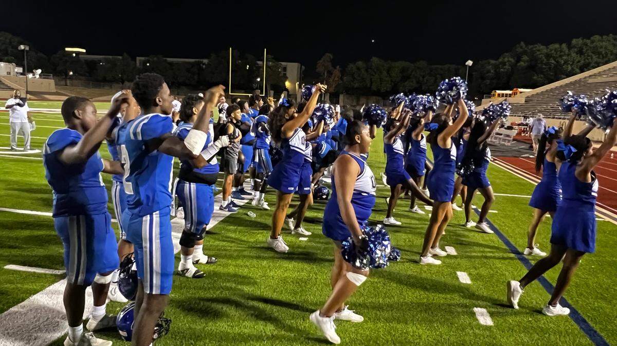 Fort Worth Dunbar celebrates a 47-2 win over Fort Worth Western Hills on Thursday at Farrington Field in Fort Worth, Texas on Sept. 28, 2023.