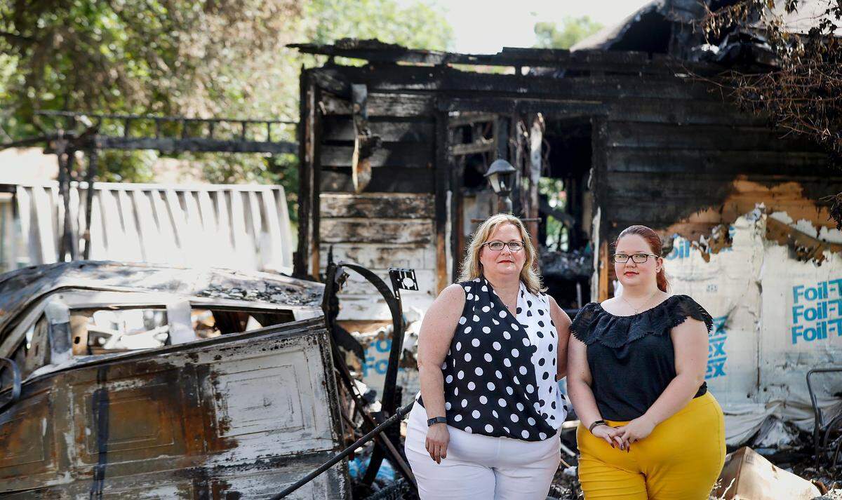 Kathi Edmonson, left, and her daughter, Paige, were visiting family when they were awoken early Sunday morning by a phone call saying the home they rented in Lakeside had been destroyed in a fire, along with nearly all their possessions. The fire is believed to be arson.