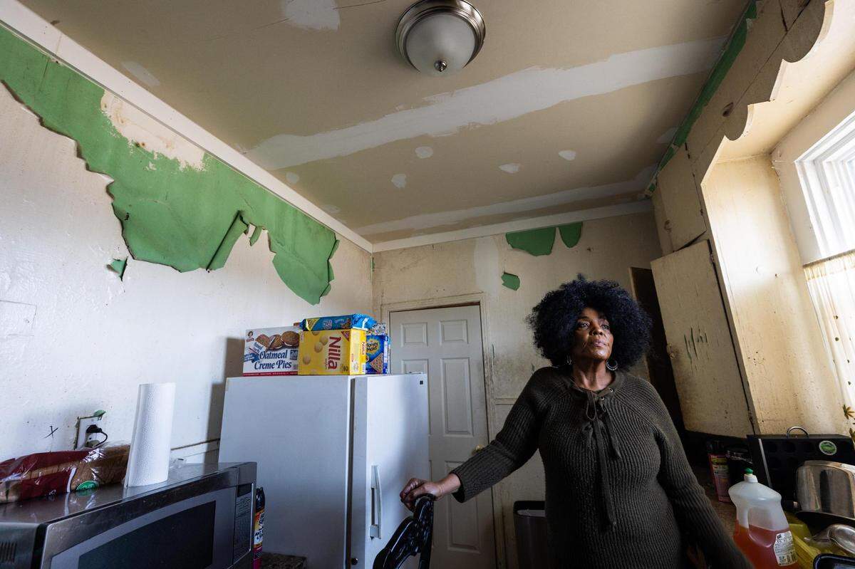 LaToshia Brooks in her kitchen where damage has been patched up but more work is needed Feb. 1, 2022, in Fort Worth. Her home needs foundational repairs but the city doesn’t provide assistance for large scale repairs.