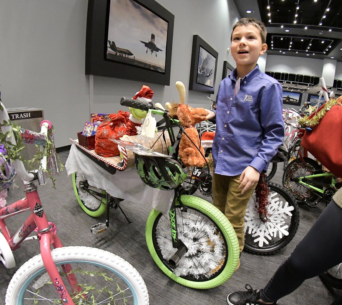 Child Study Center student Michael Bux picks out a bicycle at the Lockheed Martin Holiday Charities Parade at Lockheed Martin Aeronautics in Fort Worth, TX, Tuesday, Dec. 11, 2018. The parade was led by a Marine Corps Color Guard and the Brewer High School drum-line through the Lockheed Martin factory en route to a check and bicycle presentation from the employee donations to local community organizations.