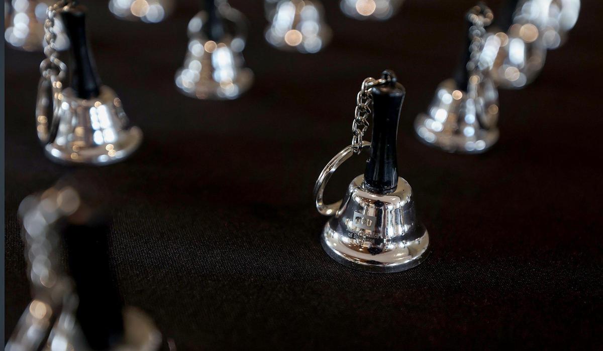 Miniature keep-sake bells were available to students, faculty and staff attending a watch party to see TCU Chancellor Victor J. Boschini Jr. and others ring the New York Stock Exchange Bell on Friday.