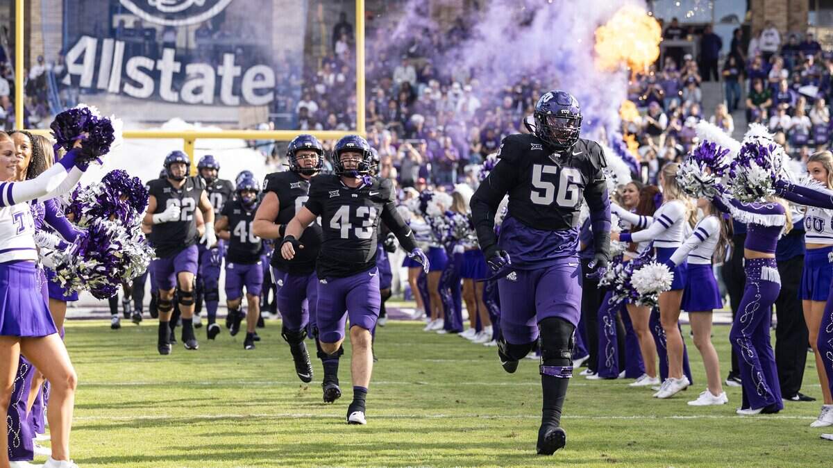 The TCU football team emerges from the tunnel prior to the first half of a Big XII conference game between the TCU Horned Frogs and the Cincinnati Bearcats at Amon G Carter Stadium in Fort Worth on Saturday, Nov. 29, 2025.