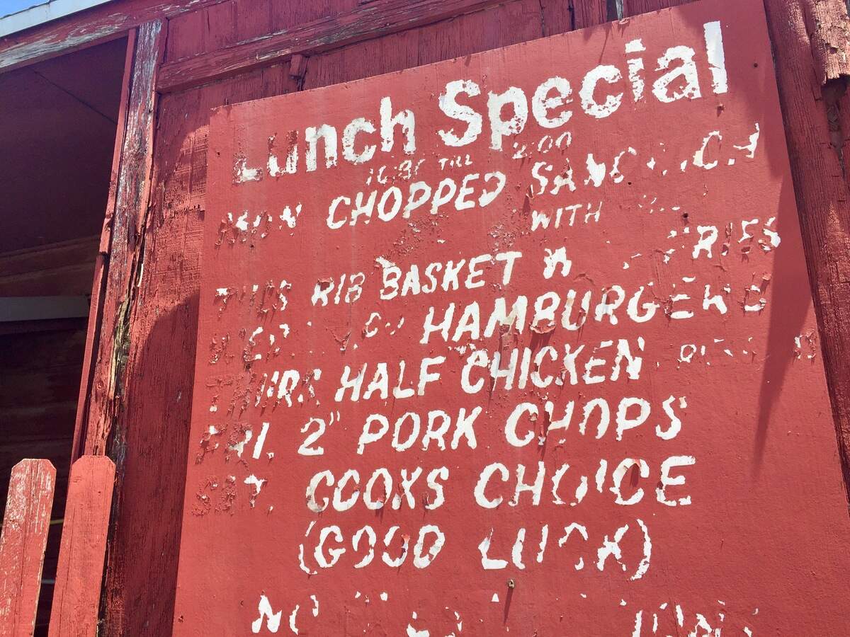 The weatherbeaten sign at the Smoke Pit barbecue restaurant.