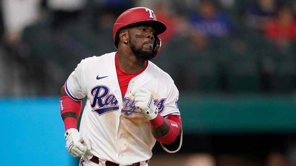 Texas Rangers’ Adolis Garcia rounds the bases after hitting a two-run home run in the fifth inning Thursday. Garcia set a Rangers’ rookie record with 31 home runs and 90 RBIs this season.
