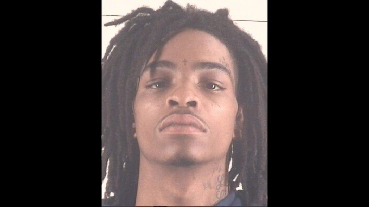 Avin Wilburn, 19, is accused of engaging in organized criminal activity-aggravated assault with a deadly weapon in connection with a shooting on May 10 that wounded five. 