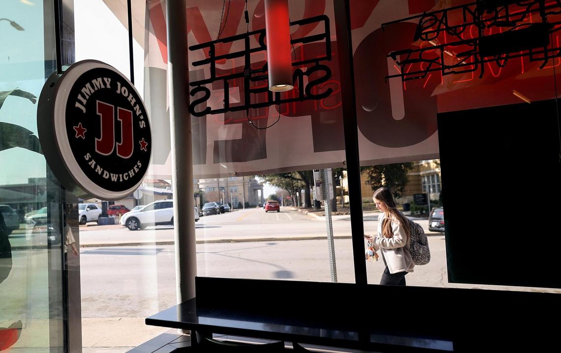 A student walks past the newly opened Jimmy Johns on University Drive on Friday, Feb. 7, 2025. Texas Christian University seniors Nate Meyer, left, and Ty Vansteenburg are co-owners of the Jimmy John’s franchise.