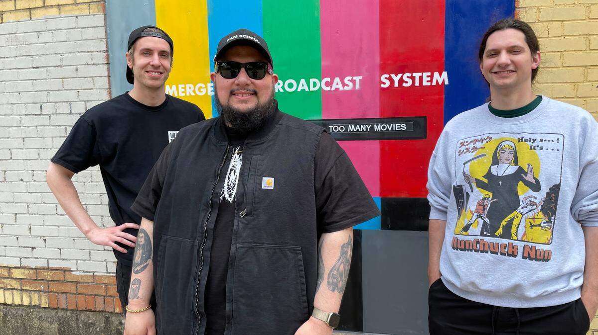 Chris Collins, Josh Rodriguez and Alex Wilshin make up the popular Dallas-based podcast “There Are Too Many Movies”. Mural created by Modest Museum (Madison Mask).