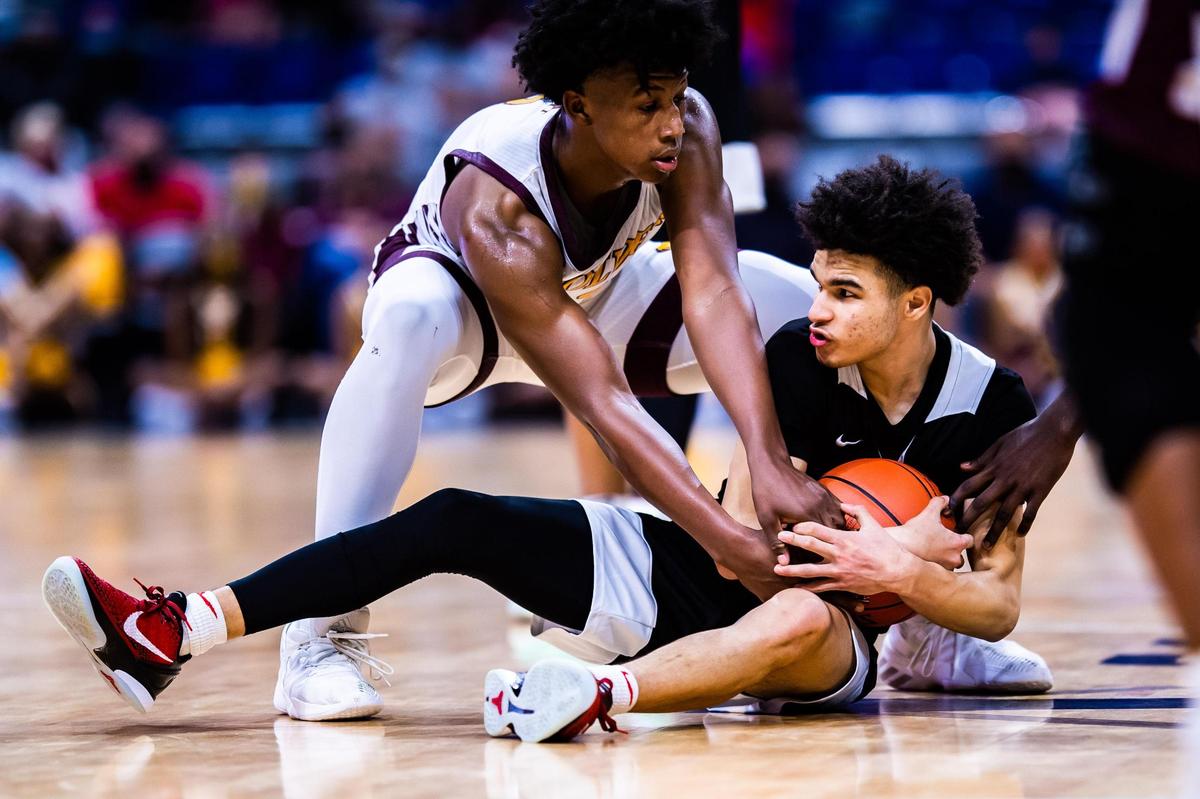 Jayden Blair fights on the ground for the ball during the 5A state final between Beaumont United and Dallas Kimball at the Alamodome in San Antonio Texas, on March 12, 2021. Beaumont United went on to win 71-70 in overtime. (Photo by Matt Smith. Special to the Star-Telegram).