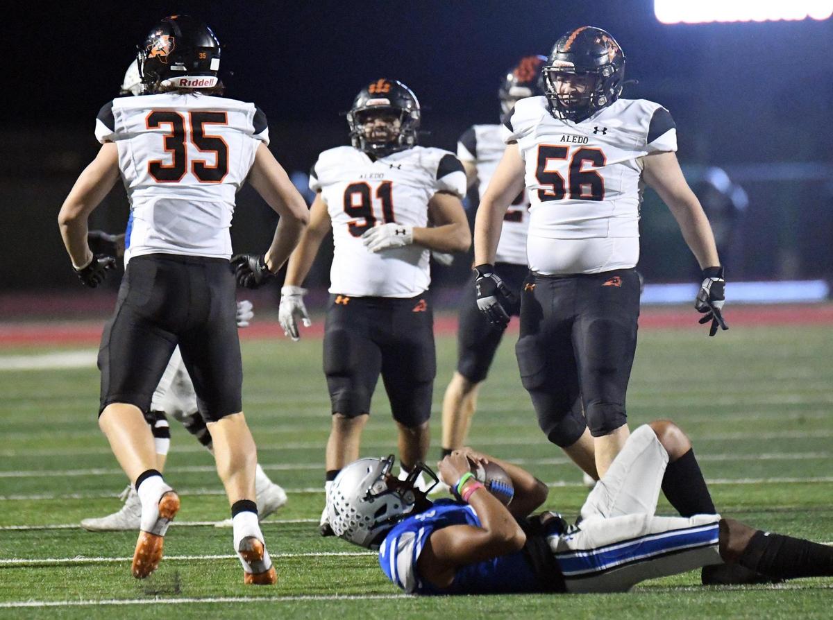 Aledo’s Carson Dempsey, left celebrates to teammates after sacking Centennial quarterback Iverson Moore for a loss in the fourth quarter of Friday’s October 14, 2022 District 3-5A Division 1 football game at Burleson ISD Stadium in Burleson, Texas. Special/Bob Haynes