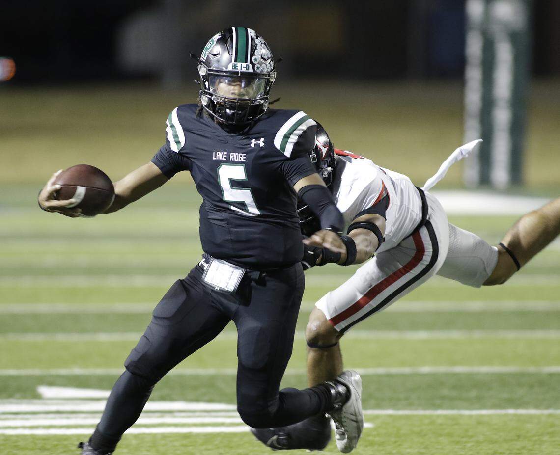 Mansfield Lake Ridge quarterback Deshawn Edwards runs for a first down against Euless Trinity during their Class 6A Division I bi-district game on Friday, November 14, 2025 at Newsom Stadium in Mansfield Texas.