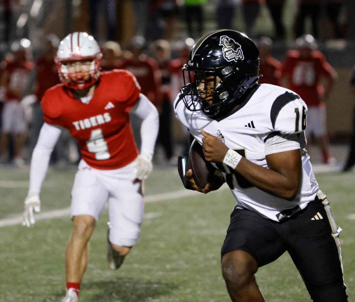 Eagle Mountain quarterback Kayden Steward (16) rounds the left corner during an UIL 4A D2 Region 1 Bi-district football playoff game at Kangaroo Stadium in Weatherford, Texas, Friday, Nov. 15, 2024.