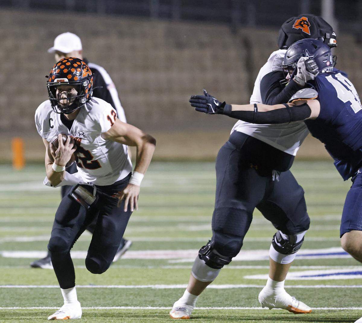 Aledo quarterback Lincoln Tubbs scrambles out of the pocket against Frisco Lone Star during the first half of a Class 5A Division I state semifinal Friday at Newsom Stadium in Mansfield.