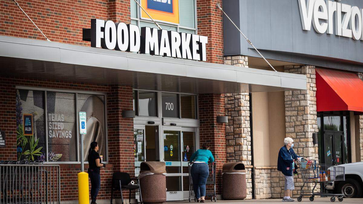 Shoppers come and go from an Aldi in Fort Worth.