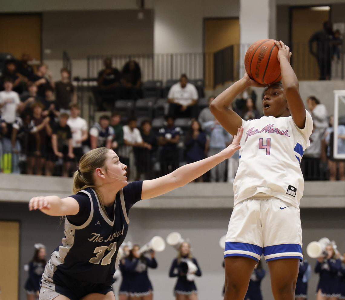 North Crowley guard Hannah Boone (4) sinks a jumper over Flower Mound guard Sydney Ziegenhorn (32) during the first half of a UIL Class 6A Division I girls regional final basketball playoff game at Arlington ISD Athletics Center in Arlington, Texas, Friday Feb. 27, 2026.