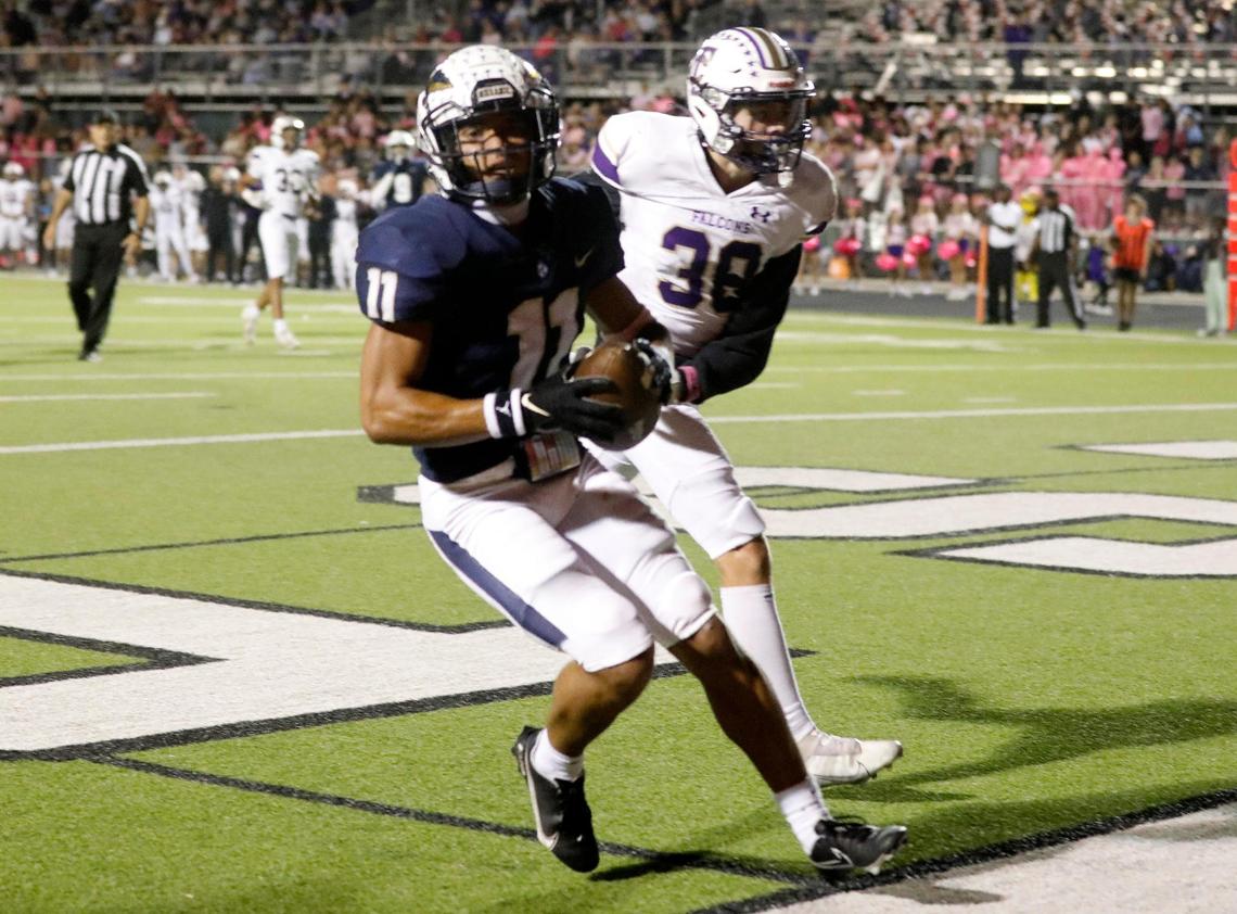 Keller wide receiver Amarion Henry (11) grabs a touchdown pass in the back of the end zone defended by Timber Creek defensive back Logan Summers (38) in the first half of a District 4-6A high school football game at Keller ISD Stadium in Keller, Texas, Thursday, Oct. 27, 2022. Keller led Timber Creek 20-3 at the half. (Special to the Star-Telegram Bob Booth)