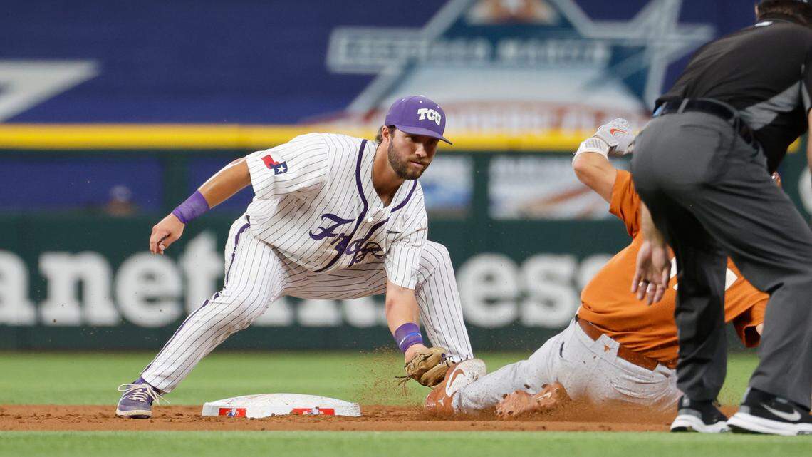 TCU second baseman Gray Rodgers, left, had two of the Horned Frogs’ four hits, including a home run, in Thursday’s 5-3 loss to Texas in the Big 12 tournament at Globe Life Field. Top-seeded TCU plays No. 4 Oklahoma State in an elimination game at 3:15 p.m. Friday.