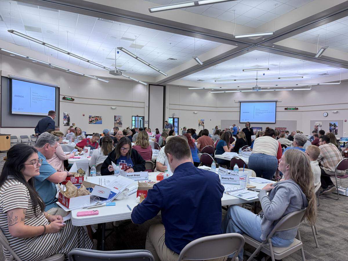 Committee members and members of the public attended the district’s presentation on the plan for school closures.