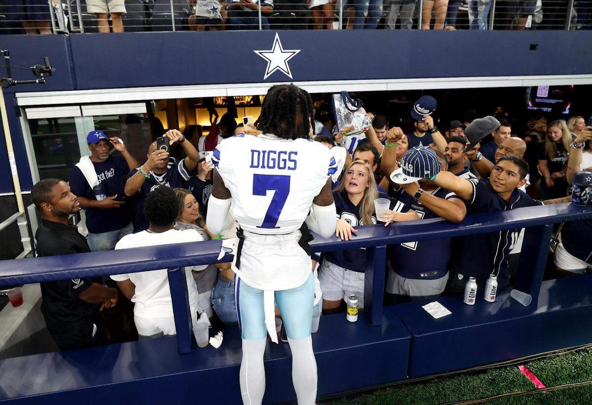 Dallas Cowboys cornerback Trevon Diggs signs autographs for fans following a win against the New York Jets on Sunday, September 17, 2023, at AT&T Stadium in Arlington.