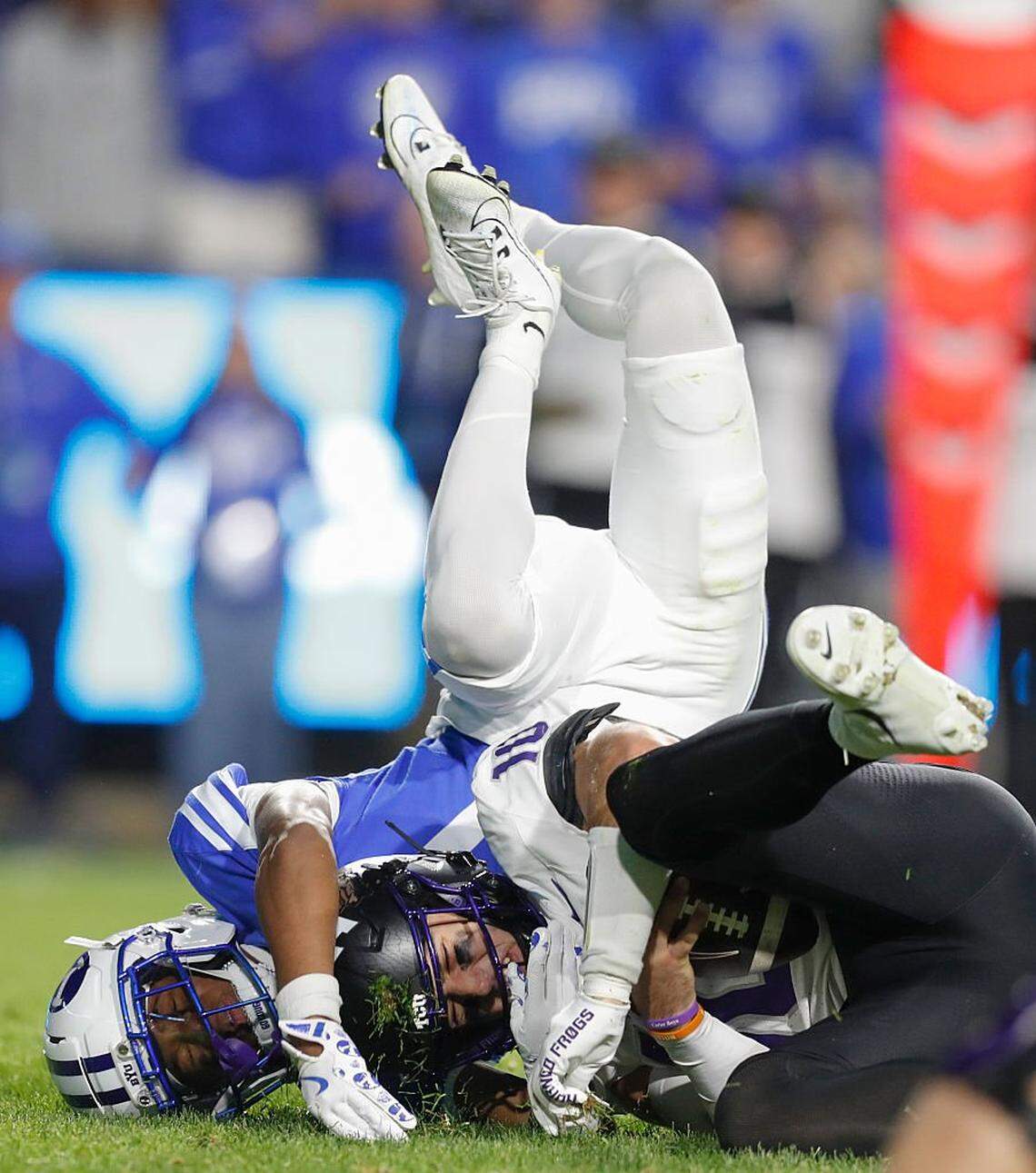 PROVO, UT - NOVEMBER 15: Evan Johnson #0 of the Brigham Young Cougars sacks Josh Hoover #10 of the Texas Christian University Horned Frogs during the second half of their game at LaVell Edwards Stadium on November 15, 2025 in Provo, Utah. (Photo by Chris Gardner/Getty Images)