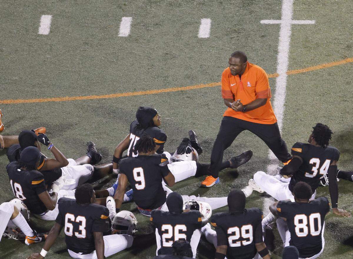 Bowie head coach Joseph Sam talks to the team after winning a UIL football game between South Grand Prairie and Arlington Bowie at UTA Maverick Stadium in Arlington, Texas, Thursday Nov. 06, 2025.