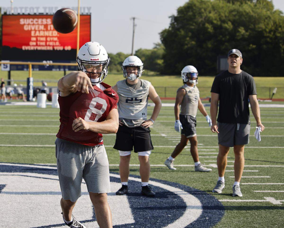 Quarterback Gavin Beard hits a short rout over the middle during the first practice of 2025 for the All Saints in Fort Worth, Texas, Tuesday August, 05, 2025.