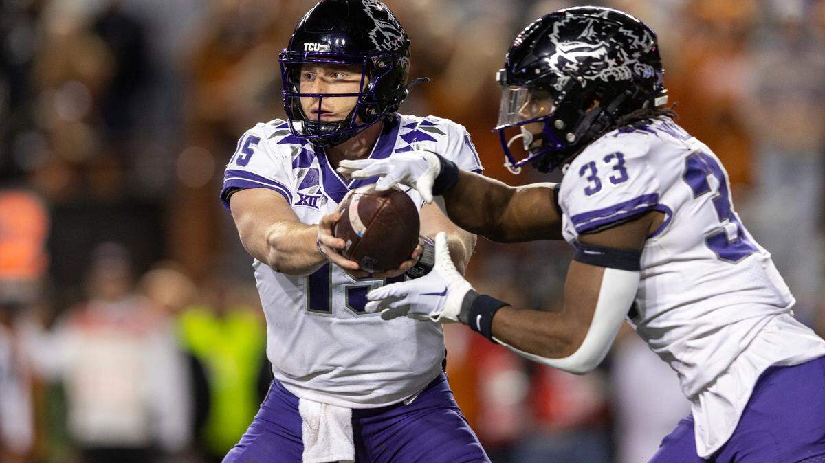 TCU quarterback Max Duggan (15) and running back Kendre Miller (33) must lead a balanced offensive attack if the Horned Frogs are to upset Michigan on Saturday.