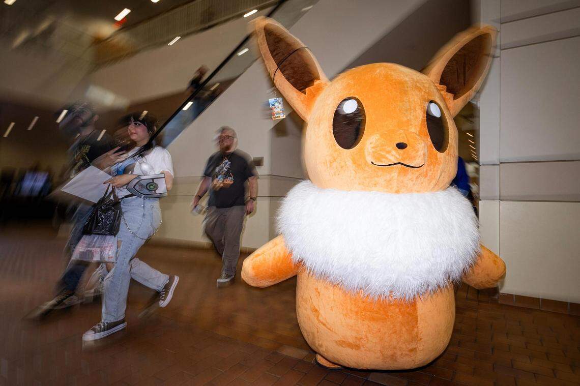 A cosplayer dressed as Eevee from Pokémon enters the Anime Frontier event at the Fort Worth Convention Center on Friday, Dec. 8, 2023.