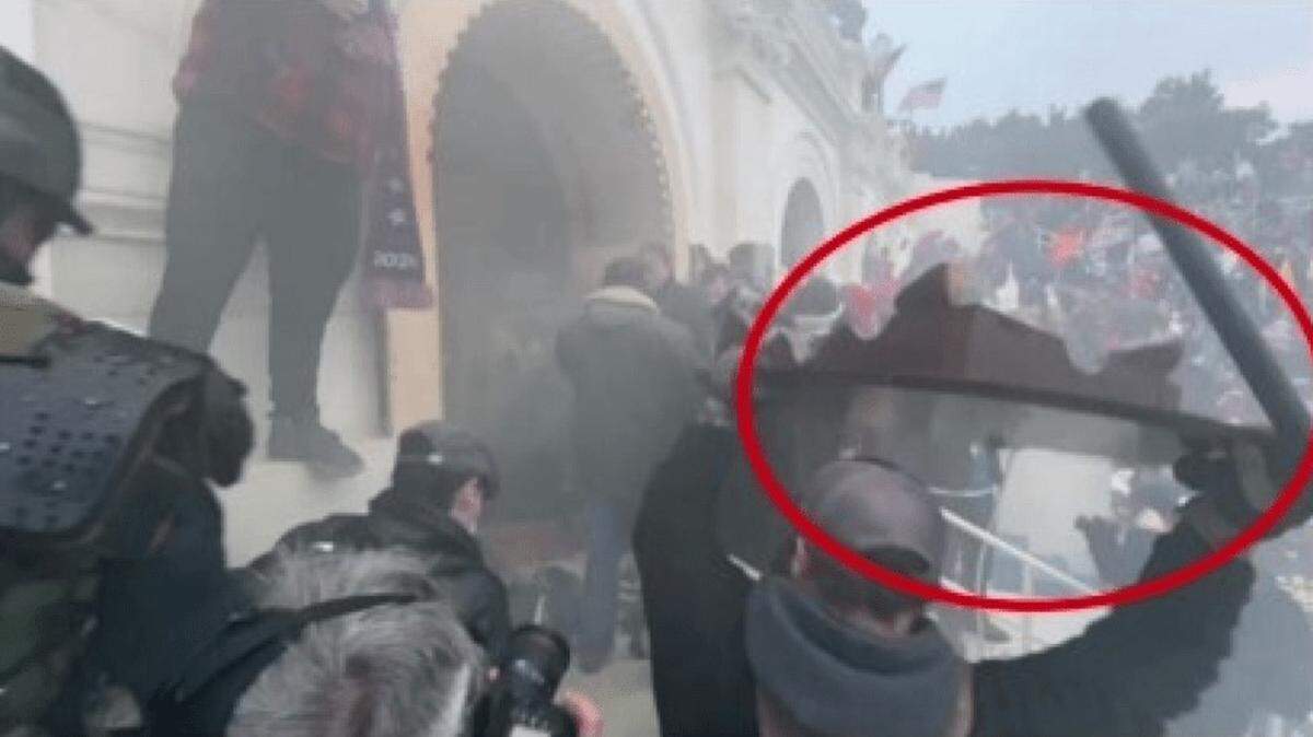 Thomas Ballard of Fort Worth, pictured in the red circle with a police baton and a table in his hands, is accused of assaulting police officers during the Jan. 6 riot at the U.S. Capitol, according to federal authorities.