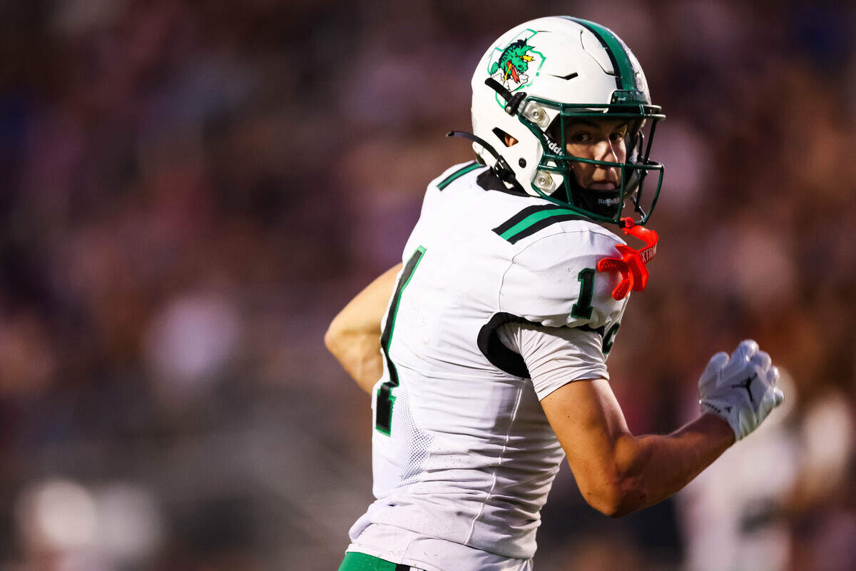 Southlake Carroll wide receiver Brock Boyd looks back at the Timber Creek defensive back that resulted in a touchdown in a district matchup between Southlake Carroll and Timber Creek at Keller ISD Stadium on Thursday Sept. 25, 2025.