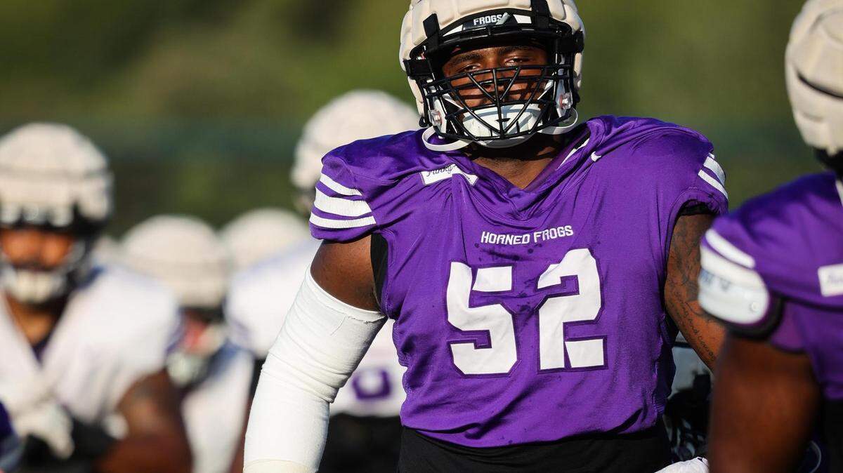 TCU Damonic Williams (52) stretches for practice Thursday, Aug. 18, 2022, at TCU Practice Field in Fort Worth. Williams is switching positions for the Horned Frogs in 2023.
