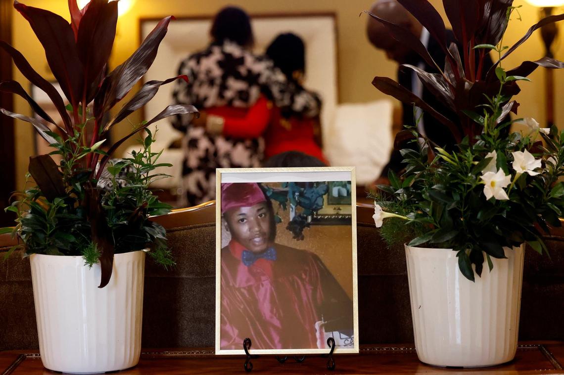 Family take a moment at Anthony Johnson Jr.’s viewing prior to his funeral on Friday, May 24, 2024, in Mansfield. Johnson was killed while in custody at the Tarrant County Jail in April.