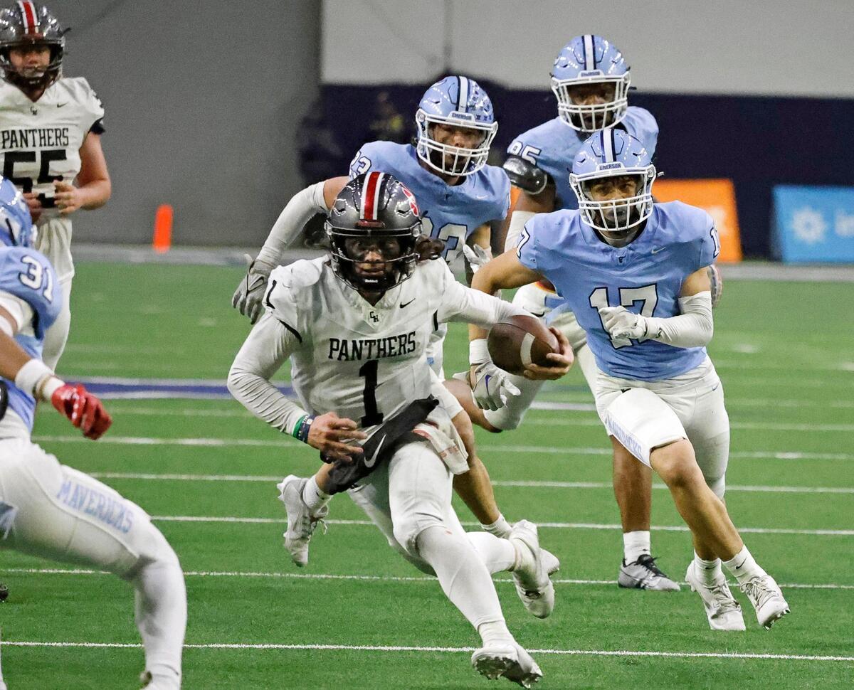 Colleyville Heritage quarterback Luke Ullrich (1) attempts to outrun the Emerson defense late in the second half of a UIL Conference 5A Division 2 quarterfinal football playoff game at The Ford Center in Frisco, Texas, Friday, Dec. 01, 2023.