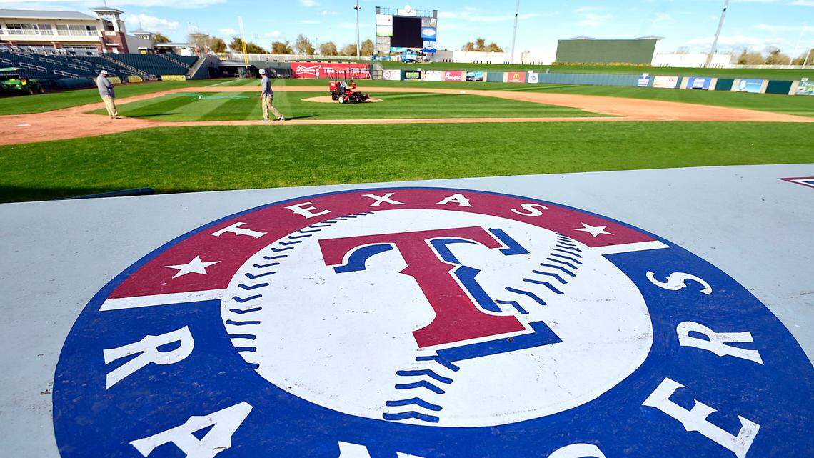 Kevin Anderson and Tony Frontzak work on mowing the grass at Surprise Stadium in preparation for the opening of the Rangers spring training in Surprise, AZ, Tuesday, Feb. 14, 2017.  