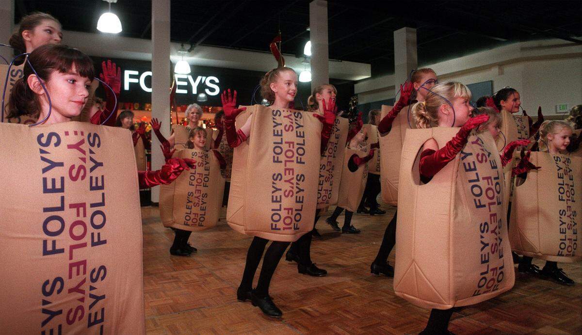 Nov. 18, 1998: Fifty-seven dancers from the Dian Clough West Dance Studio dressed up like tap-dancing Foley's shopping bags perform as part of the opening ceremonies for the new Foley's store at Ridgmar Mall.