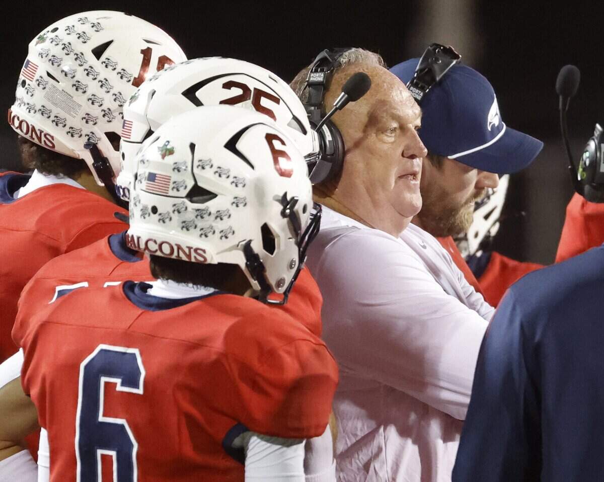 Country Day head coach Keith Burns talks with the team during a timeout during the first half of the SPC 2025 3A Football Championship football game between The Oakridge School and Fort Worth Country Day at Mavericks Stadium in Arlington, Texas, Saturday Nov. 08, 2025.
