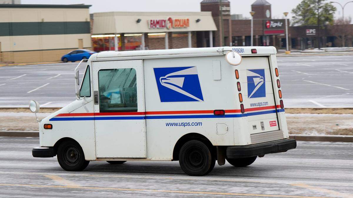 USPS truck is pictured after a blast of winter weather in Edmond, Wednesday, Feb. 12, 2025.