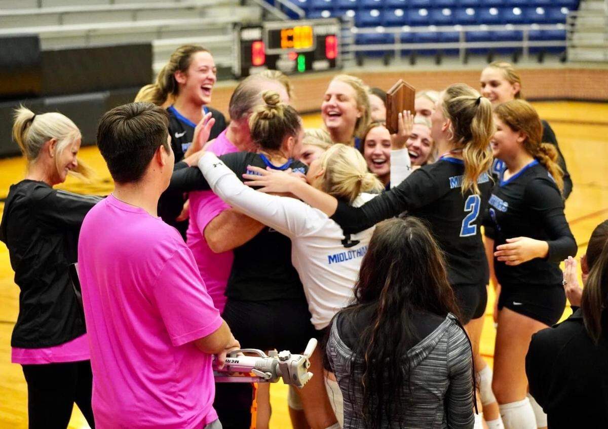 Midlothian hug head coach Shain Sackett after the Panthers won the Mansfield ISD tournament on Saturday August 13, 2022. It was Sackett’s 400th career win (Heather McMichael/Courtesy)