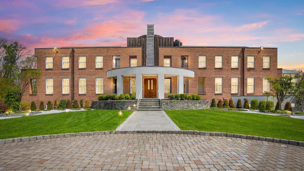 The front of the mansion has a hospital-like appearance.