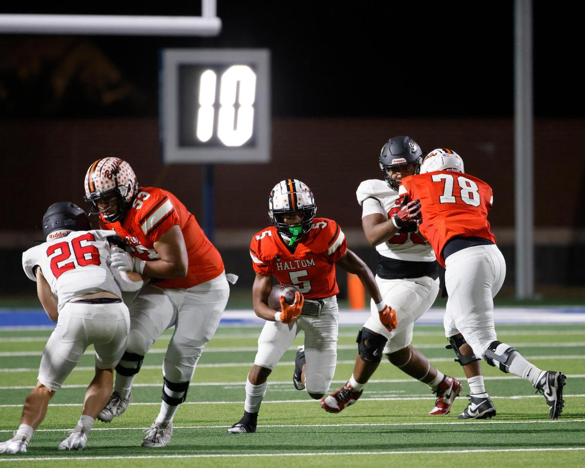 Haltom running back Vudrico Roberson (5) heads up field during a UIL District 8-6A football game at Birdville Fine Arts/Activity Complex in North Richland Hills, Texas, Thursday, Oct. 31, 2024.