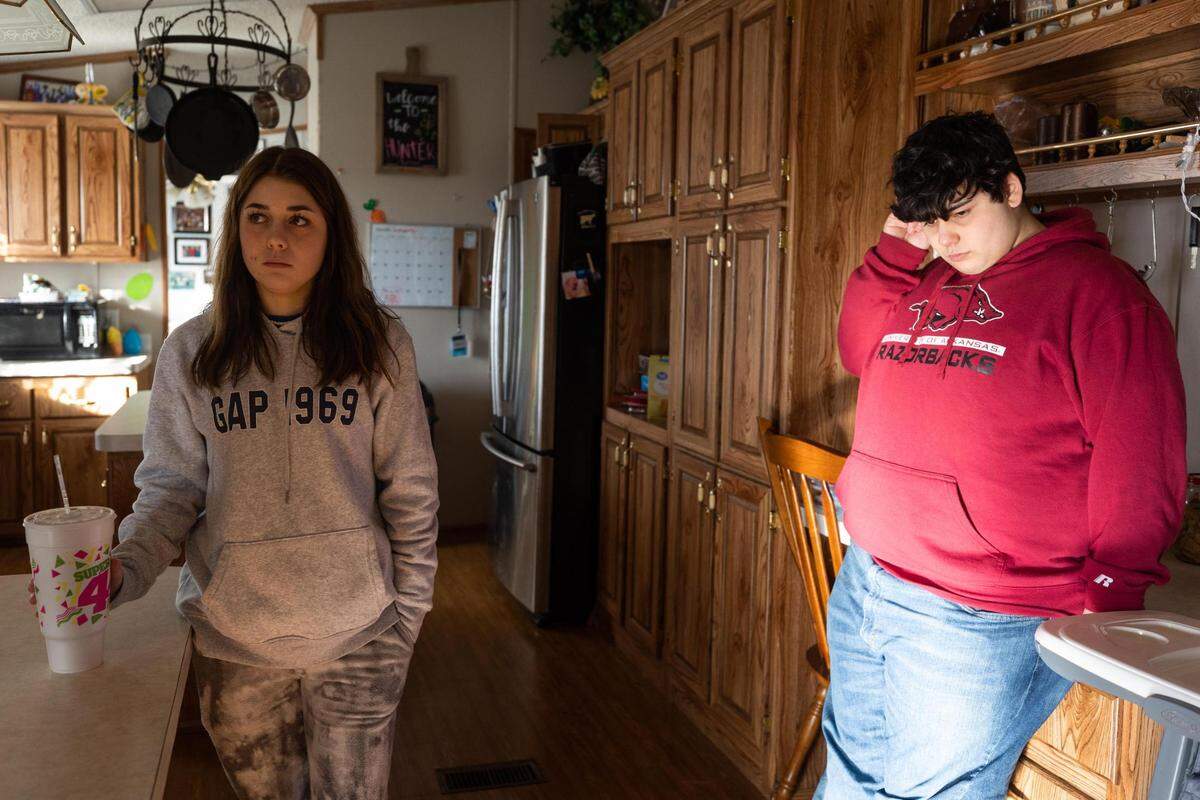 Aden Stasney, 15, who is on the autism spectrum, and his sister, Myanna, 15, chat in the kitchen with their mother Feb. 22, 2022, in Van Alstyne. Aden’s mother says if his school had followed his IEP, he wouldn’t be facing criminal charges for a scuffle with a staff member.